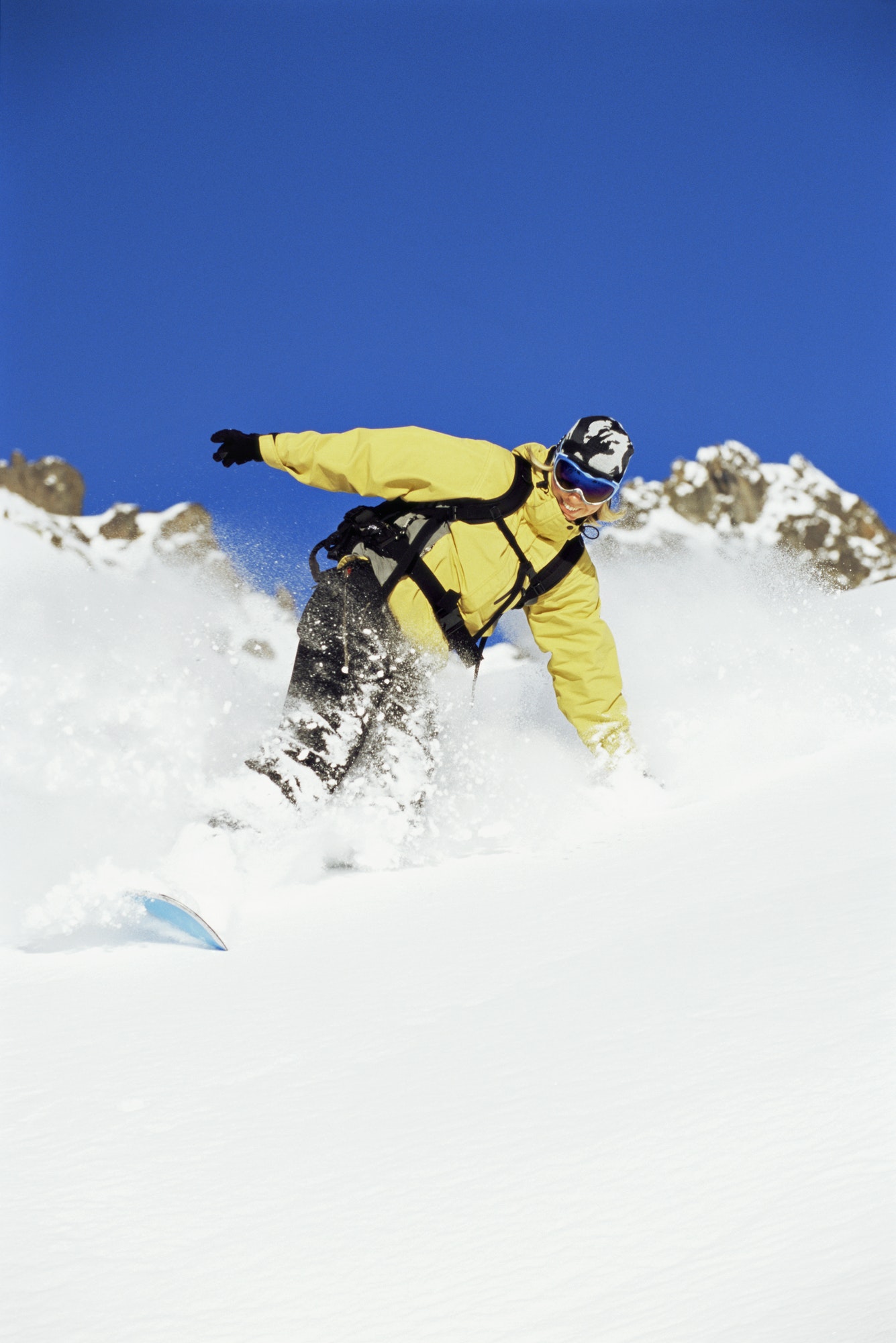 young woman snowboarding 1